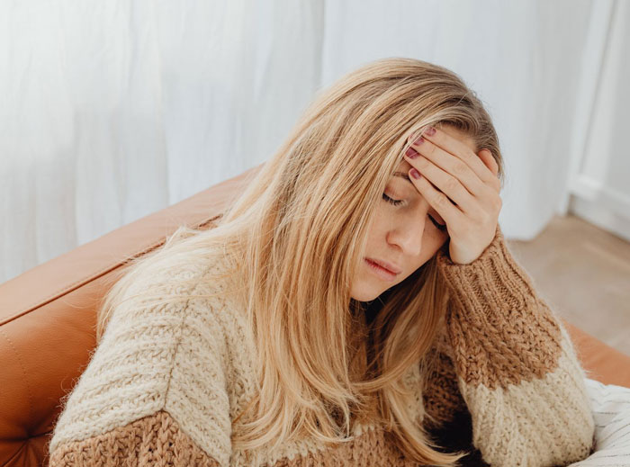 A woman looking stressed, reflecting the emotional toll of an entitled aunt trying to take over home and job. A woman looking stressed, reflecting the emotional toll of an entitled aunt trying to take over home and job.