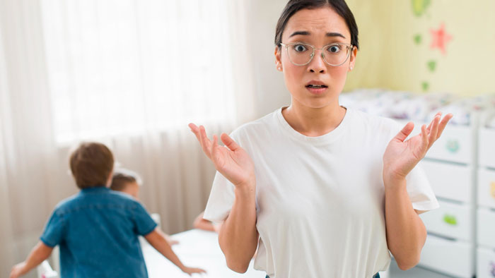 An exasperated teacher looking at the camera, frustrated by an entitled mom treating the community class as free daycare. An exasperated teacher looking at the camera, frustrated by an entitled mom treating the community class as free daycare.