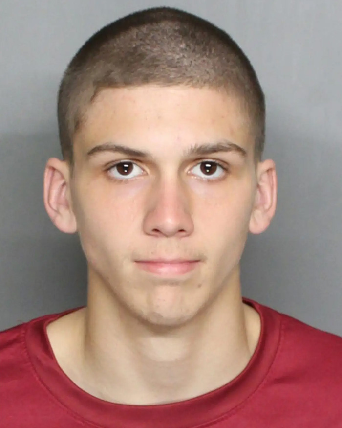Mugshot of a young man with a buzz cut and serious expression, linked to stupid arrests.