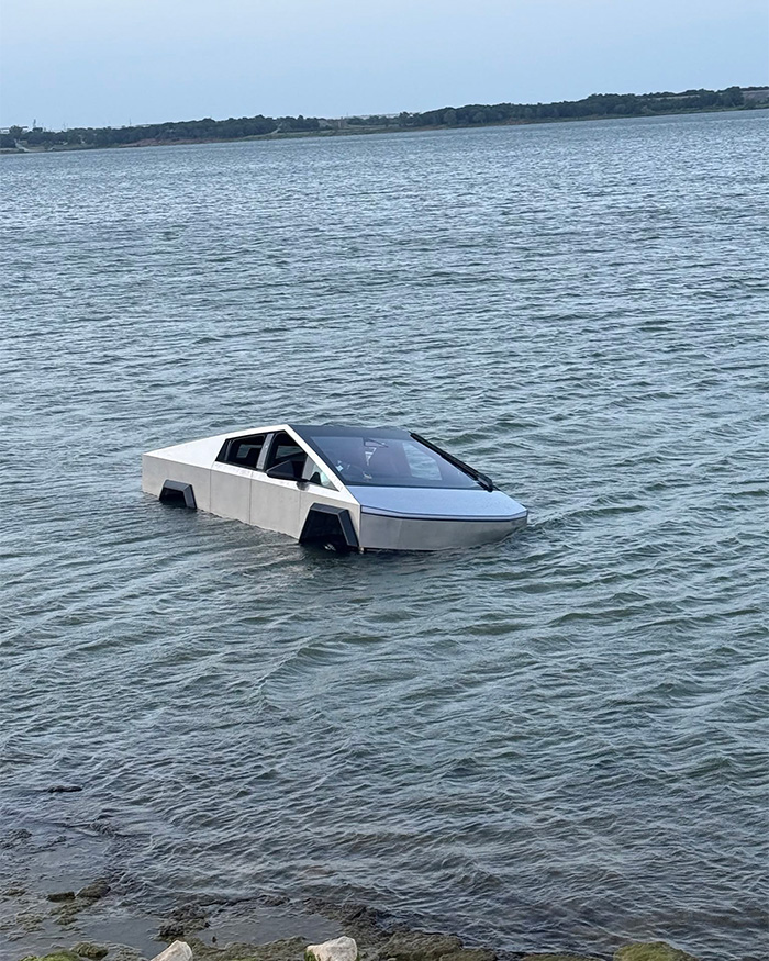 A Tesla Cybertruck partially submerged in water, an image related to stupid arrests or unfortunate incidents.