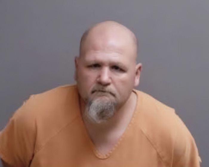 Mugshot of a bald man with a goatee, illustrating one of the stupid arrests that made us lose faith in humanity.