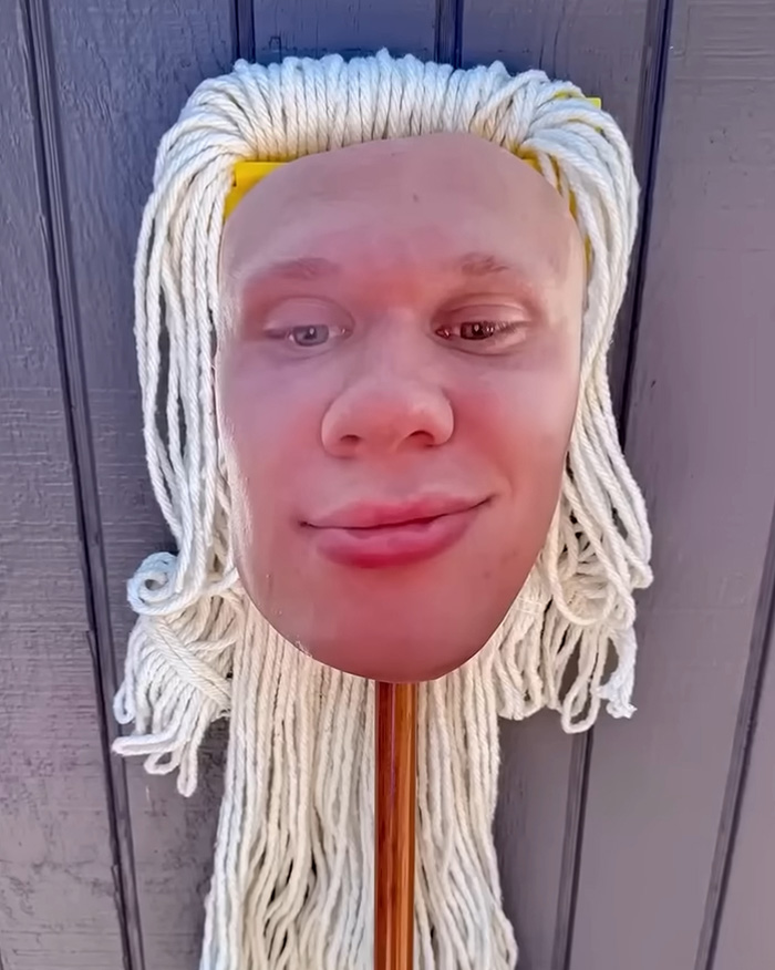 A mop with a face mask of Erling Haaland, representing the internet's funniest memes.