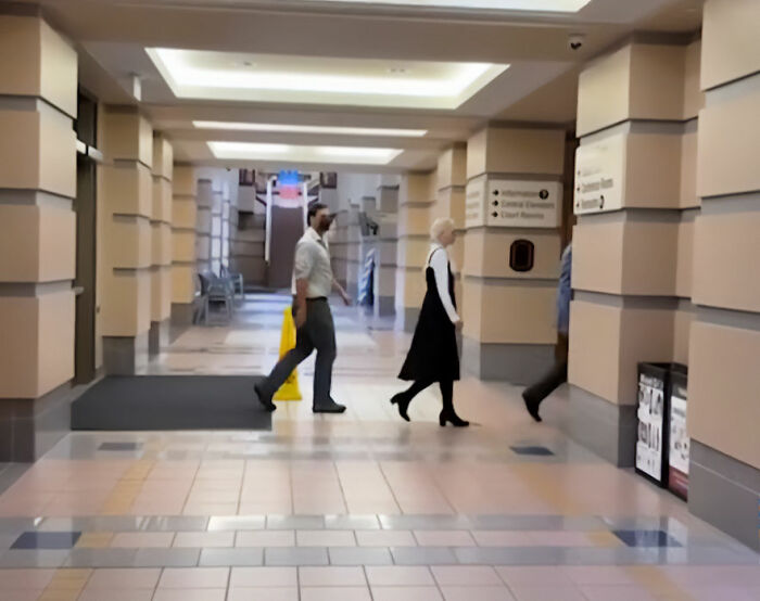 People walking through a courthouse hallway; White Minnesota mom learns fate after hurling racial slur at Black autistic child. People walking through a courthouse hallway; White Minnesota mom learns fate after hurling racial slur at Black autistic child.