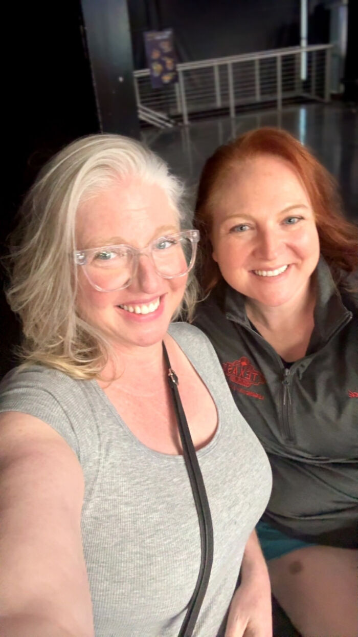 Two women smiling together, illustrating surprising facts that don't match people's looks.