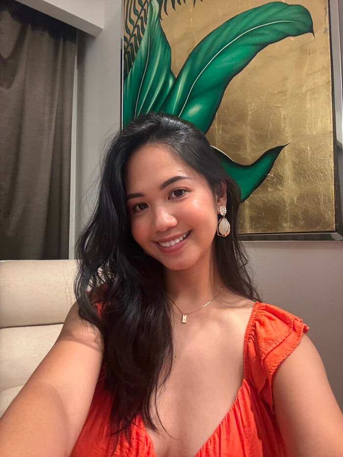 A smiling woman with long dark hair, her friendly face hiding surprising facts about people's looks.