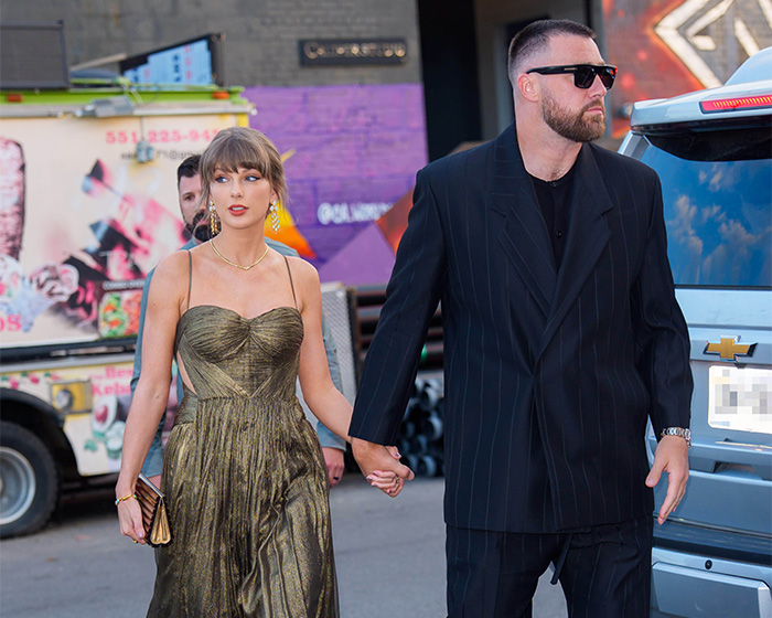 Taylor Swift and her husband hold hands, with fans disappointed by Trump's trolling during her wedding. Taylor Swift and her husband hold hands, with fans disappointed by Trump's trolling during her wedding.