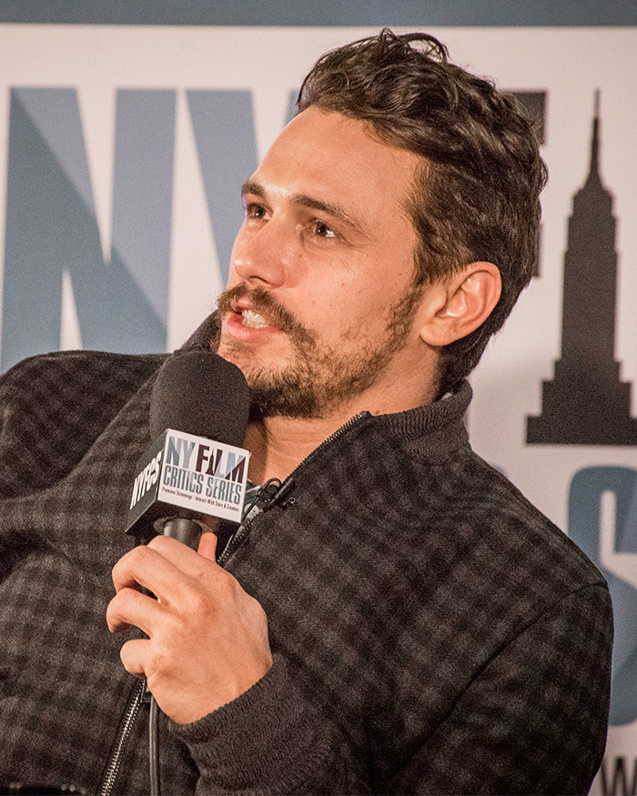 James Franco speaking into a microphone, discussing the alien reveal error. James Franco speaking into a microphone, discussing the alien reveal error.
