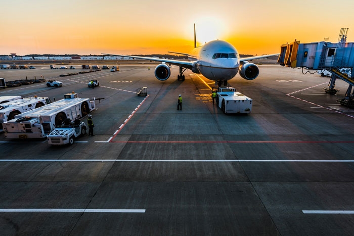 An airplane at an airport runway during sunset. The SEO keywords for this image are toxic parents and airport security. An airplane at an airport runway during sunset. The SEO keywords for this image are toxic parents and airport security.