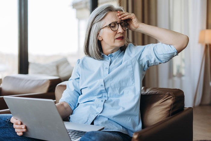 An overbearing FMIL, frustrated and holding her head, after a baby name announcement mishap. An overbearing FMIL, frustrated and holding her head, after a baby name announcement mishap.