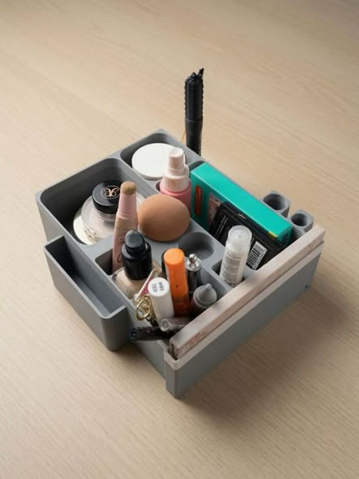 A 3D printer created makeup organizer filled with various cosmetics, a functional item for everyday use.