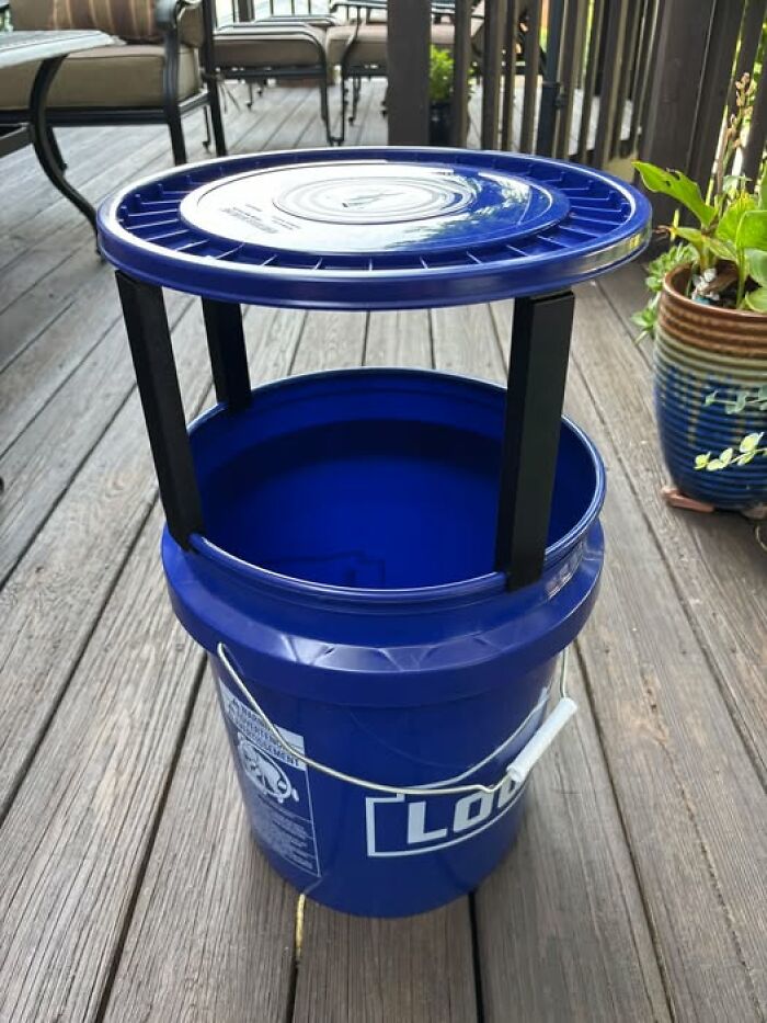 A blue bucket with a 3D printer lid and legs, demonstrating functional 3D printed objects.