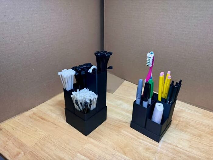Two 3D printed organizers for pens and cable ties, demonstrating functional 3D printing.