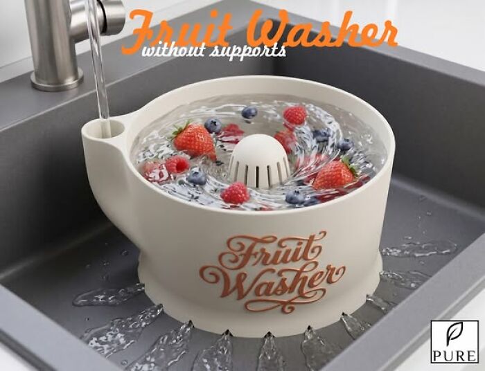 A 3D printed fruit washer with berries in a kitchen sink, an example of functional 3D printing.