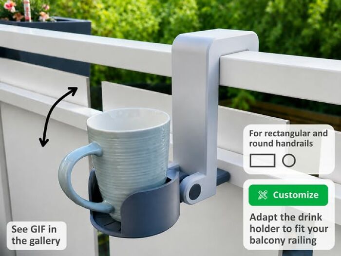 A 3D printer created balcony cup holder attached to a railing, holding a light blue mug. It is functional and cool.