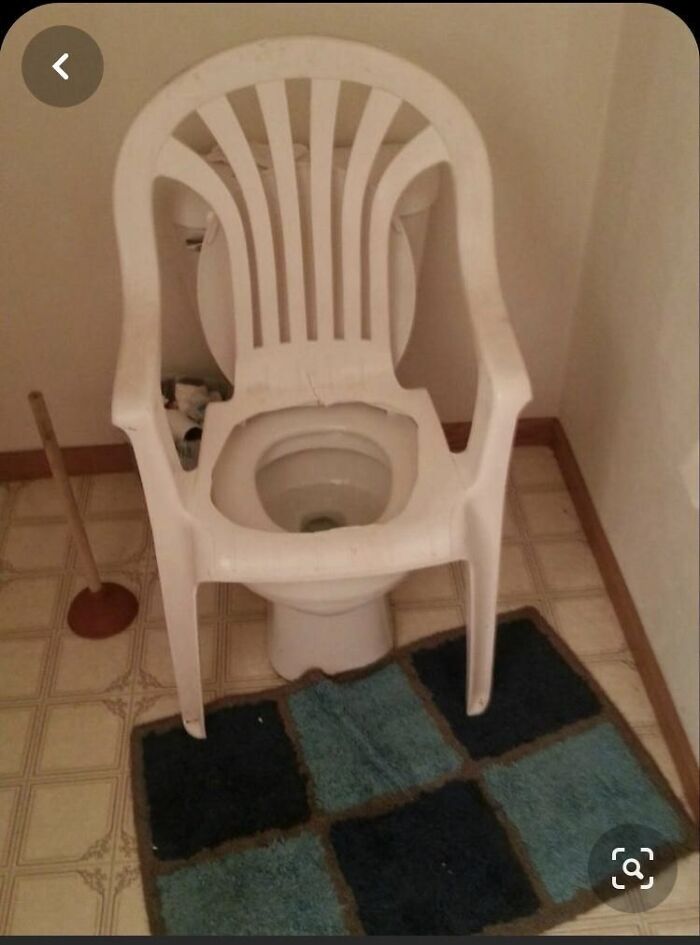 A ridiculously designed bathroom featuring a white plastic patio chair placed directly over a toilet.