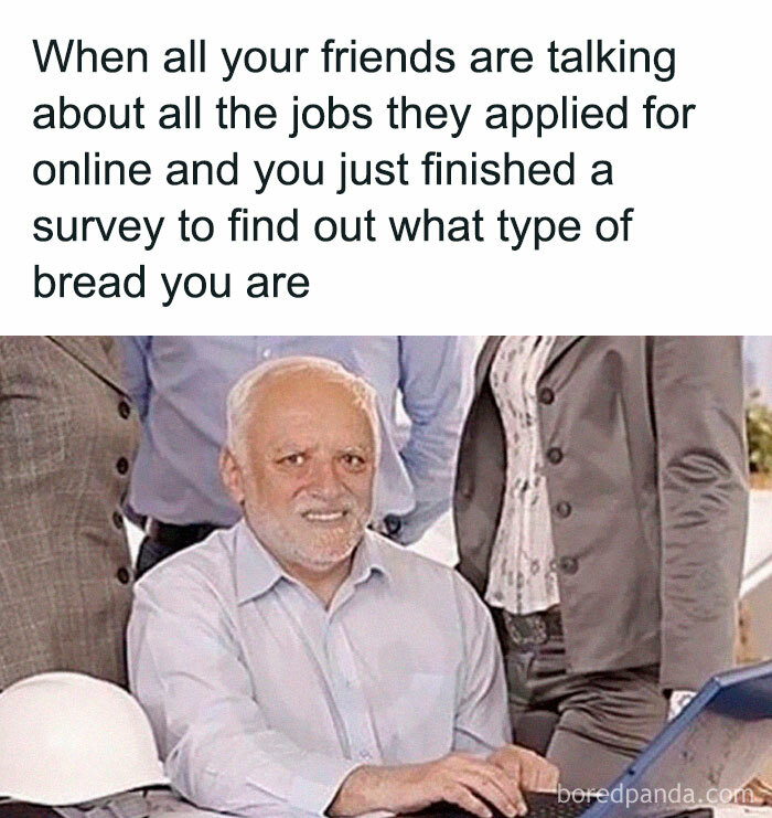 Harold, a man trying to hide his pain, sitting at a desk with people in suits behind him, a famous ancient meme.