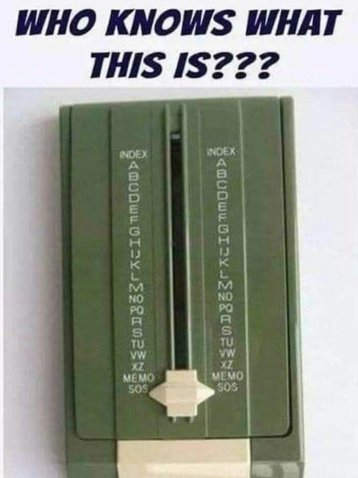 A green manual rolodex-style address book, a classic item bringing back Gen X memories.