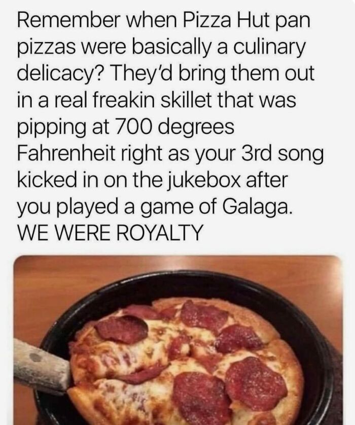 A close-up of a sizzling pepperoni Pizza Hut pan pizza in a black skillet, a nostalgic Gen X memory.