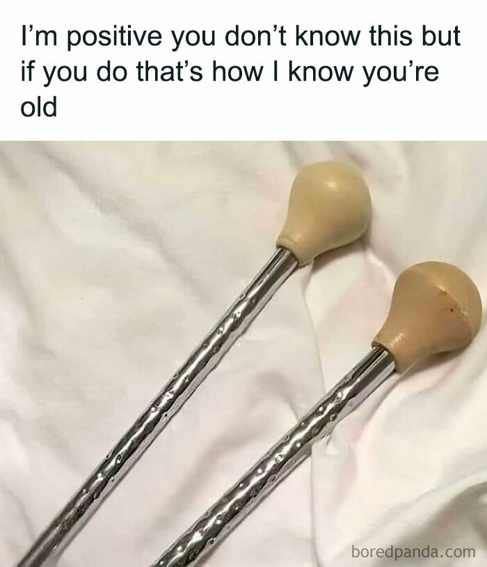 Two baton twirling sticks, a nostalgic Gen X item, on a white surface.