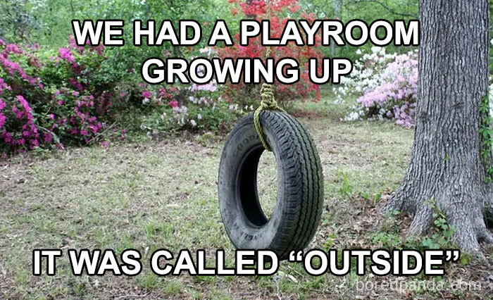 A tire swing hanging from a tree in a backyard, representing Gen X memories of playing outside.