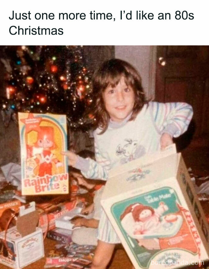A young Gen X girl smiling with 80s Christmas presents, including Rainbow Brite and Cabbage Patch Kids, evoking memories.