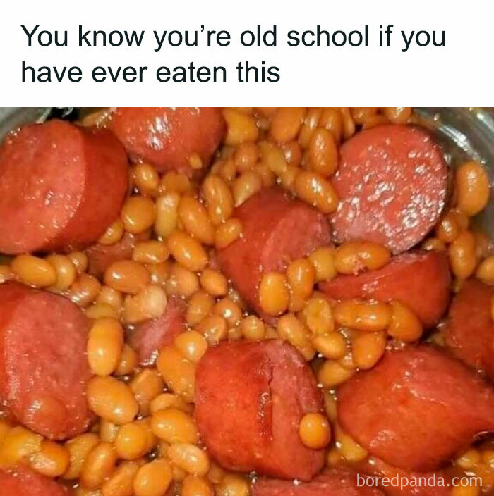 A close-up of baked beans with sliced hot dogs, a Gen X meme that might unlock forgotten memories.