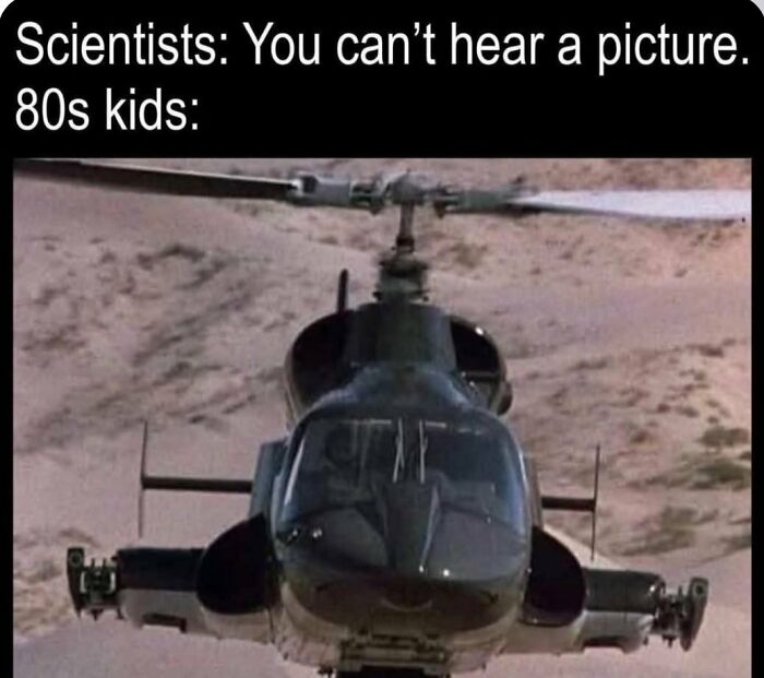 A military helicopter flying over a desert landscape, a common Gen X meme referencing 80s action films.
