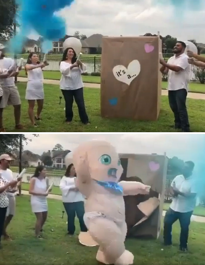 A gender reveal moment with a baby mascot emerging from a box, surrounded by blue smoke and excited parents.
