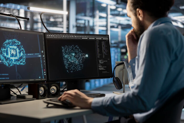 A man working on a computer with two monitors displaying complex data, hinting at common things that may be worse than we realize.