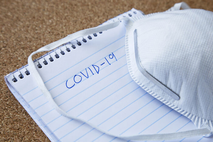 A face mask and a notepad with COVID-19 written on it, representing common things that are worse than we realize.