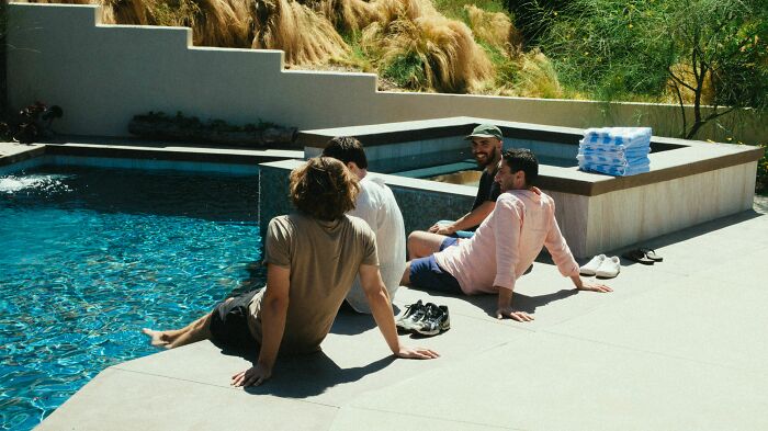 Men were made aware of cheating at a poolside gathering by observant kids.