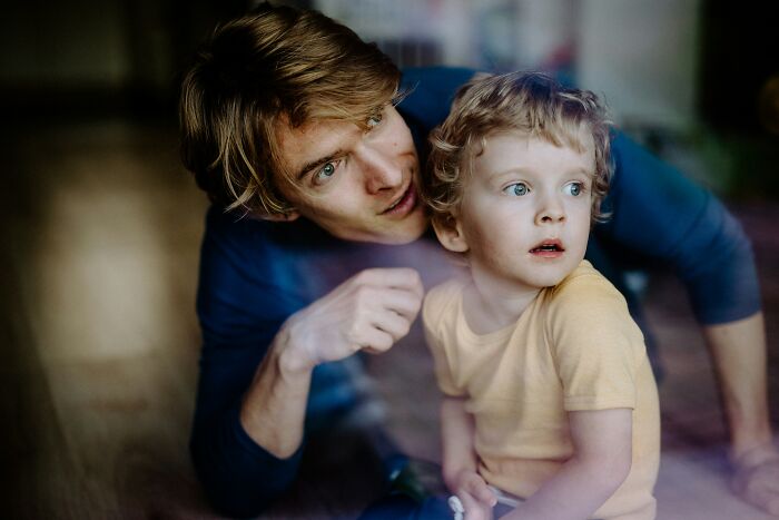A man looking at a little kid, illustrating how kids see and notice everything about being cheated on.