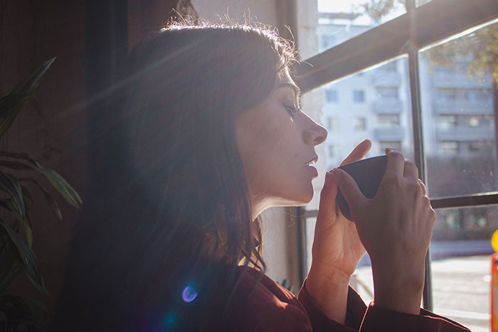 Woman with sun flare, deep in thought, talking herself into breaking up with childish BF. Woman with sun flare, deep in thought, talking herself into breaking up with childish BF.