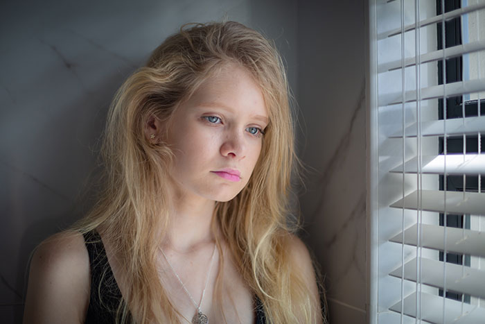 A woman looking sad, reflecting on her misery and the need to break up with childish BF. A woman looking sad, reflecting on her misery and the need to break up with childish BF.