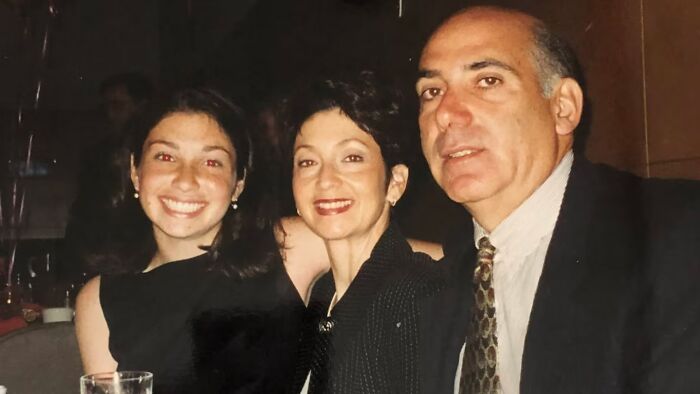 A smiling family of three, two women and a man, captured in a photograph related to unsolved mysteries.
