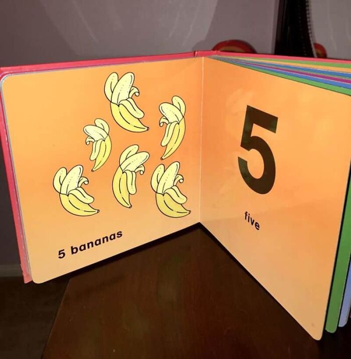 An open children's book displaying the number 5, illustrating five bananas, with the text '5 bananas', a design fail.