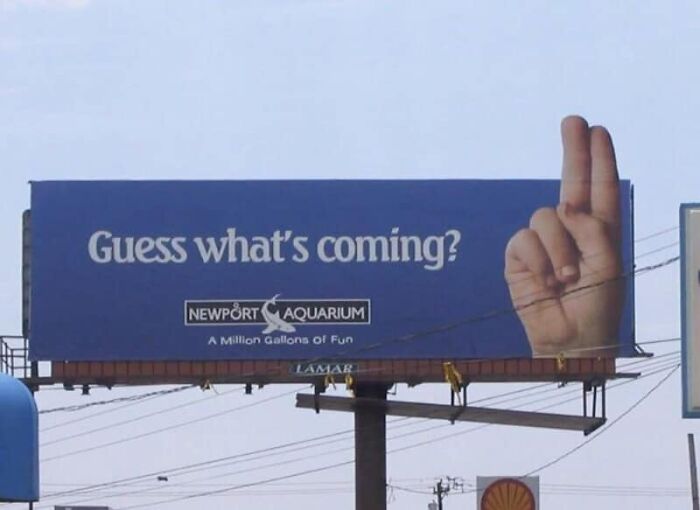 A billboard for Newport Aquarium with a hand making a rude gesture, an epic designer fail.