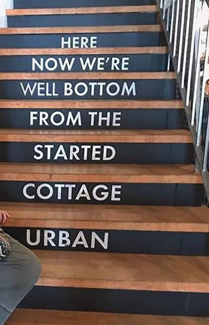 A staircase with words on each step, creating a jumbled phrase, a clear example of designers failing.