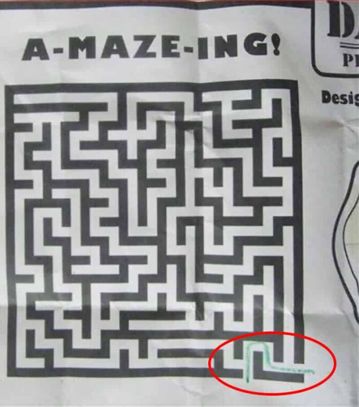 A maze with a pre-drawn path circled in red, showing designers failed their job by solving it.