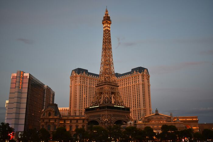 The illuminated Paris Hotel and Eiffel Tower replica, offering helpful hotel industry secrets for your next vacation.