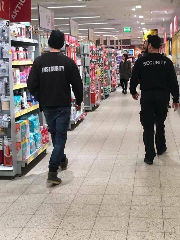 Two men in a store aisle, one with Insecurity on his shirt, the other Security, part of entertaining memes.