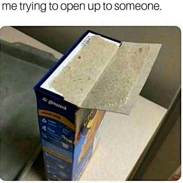 A meme showing a macaroni and cheese box with its flaps barely open, illustrating the struggle of trying to open up to someone. This is a meme from No Context Humans.