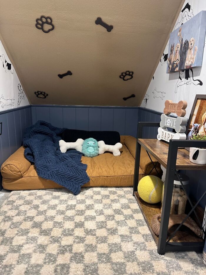 A cozy dog nook, showcasing a creative home DIY project with a plush bed, bone and paw print decor.