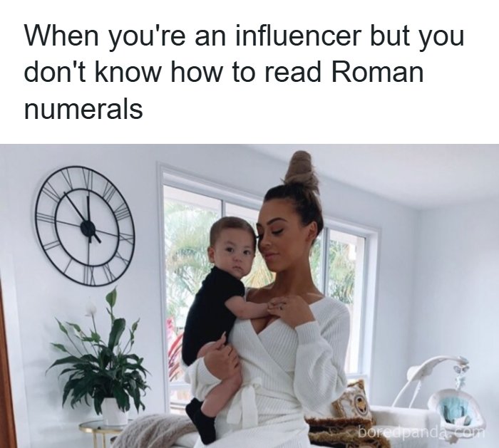 An influencer mother holding her baby in front of a Roman numeral clock, highlighting a cultural decline into idiocy.