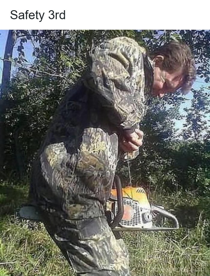 A man in camouflage shorts holding a running chainsaw precariously between his legs, exemplifying cultural decline.