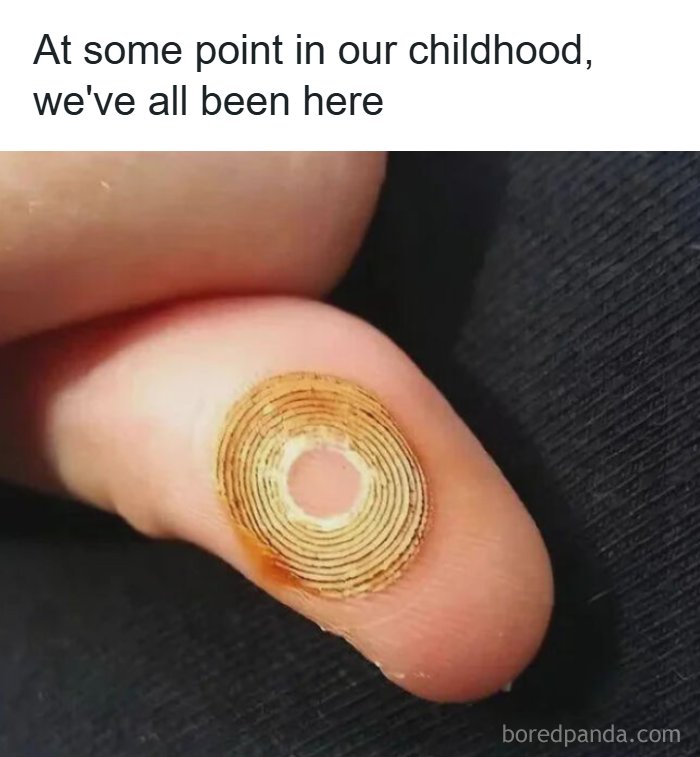 Close-up of a finger with a sticker design on it. People often need jokes explained to them.