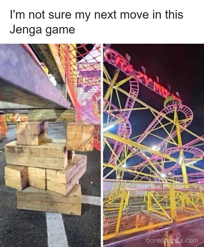 A precarious roller coaster support structure made of wood blocks, reflecting America's cultural decline into idiocy.