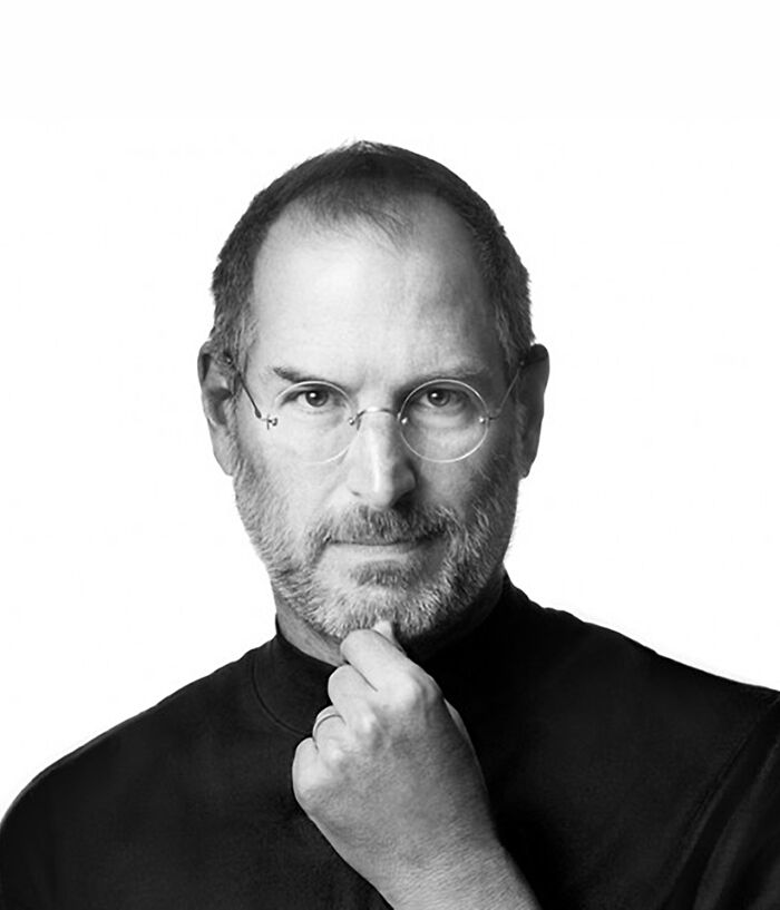 A fascinating masterpiece reimagined: a black and white image of a man's head from behind, with his hand touching his neck.