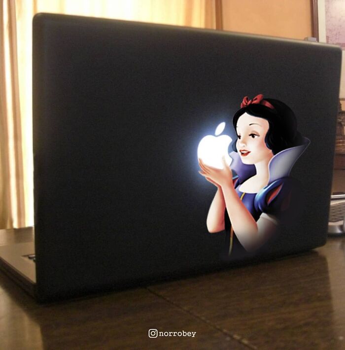 Digital artist blends famous movies and classical art: Snow White holding a glowing Apple logo on a laptop.