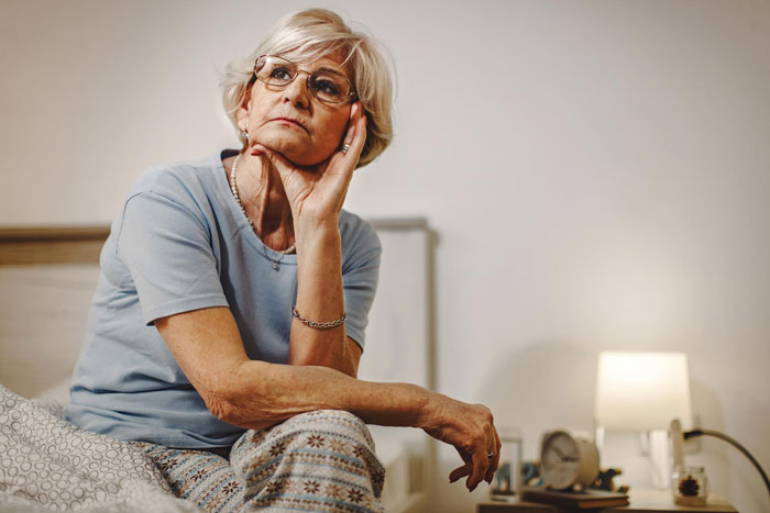 An evil mom looking thoughtful, contemplating her next move after dad left his daughter a $200K inheritance. An evil mom looking thoughtful, contemplating her next move after dad left his daughter a $200K inheritance.